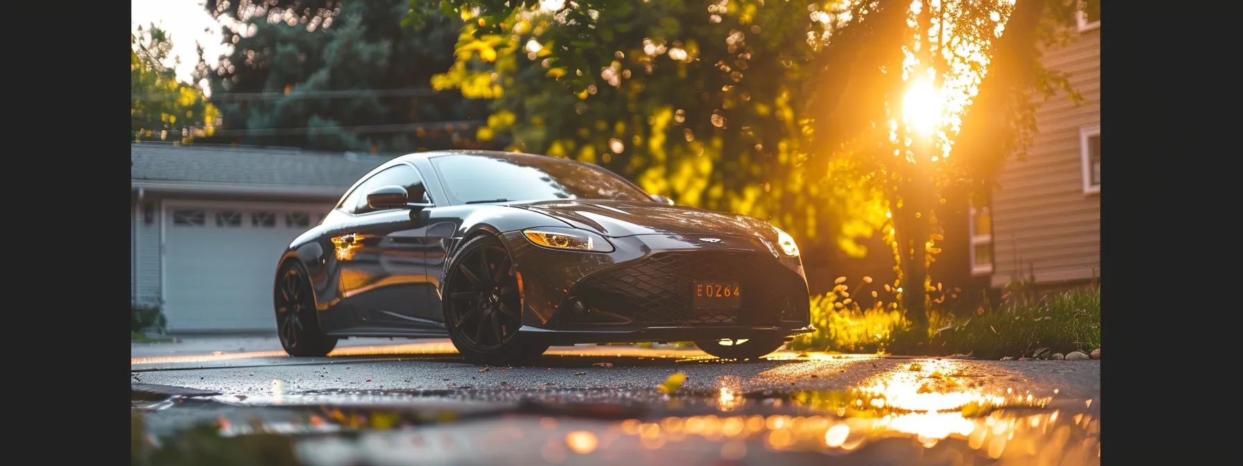 a sparkling clean car parked in a bright, sunny driveway.